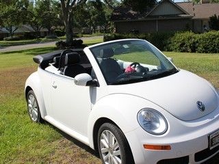 Like new, garage kept, 2009 vw bug convertible with less than 9000 miles.