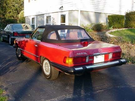 1985 red mercedes 380sl. tan interior, rag and hard top, ac, new tires.