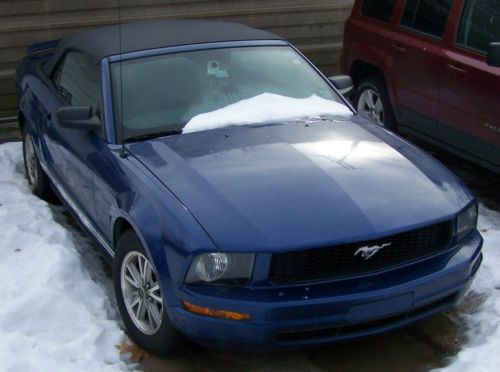 2006 blue mustang convertable with white trim