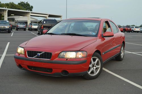 2001 red volvo s60 2.4l i5 automatic w. heated seats, moon roof, premium sound