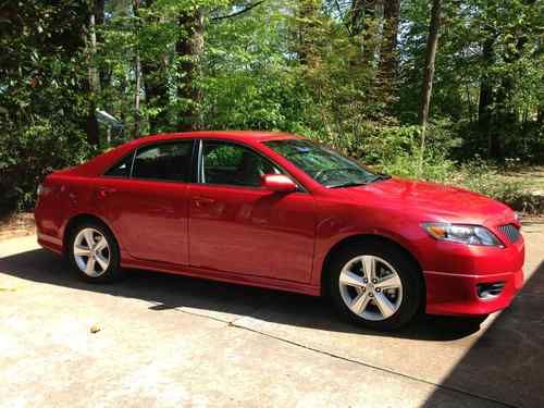2011 toyota camry, red in color, gray interior cloth seats