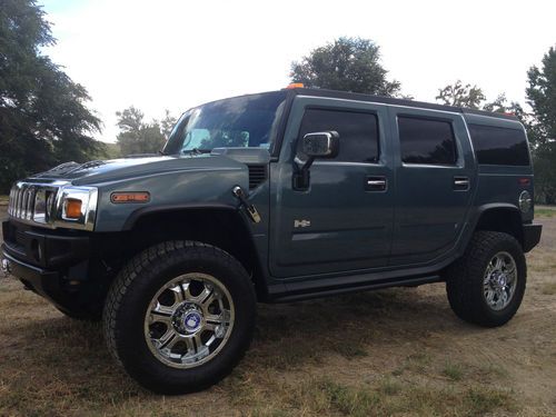 2005 hummer h2 with 83k miles no res in great shape, dvd,nav,20" wheels + extras