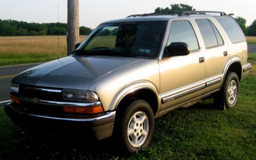 1999 4wd suv,beige met./gray cloth,moonroof/v-6,auto,full power,alloys,needs eng