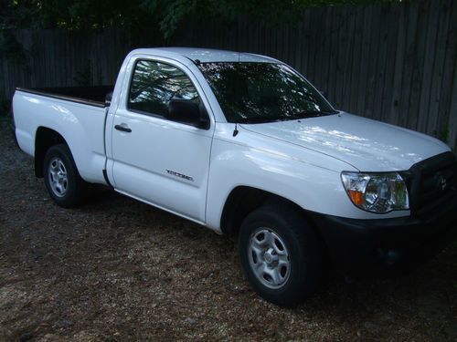 Lightly used toyota tacoma, white, base model, excellent condition, cold ac