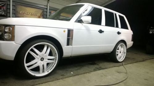 Enjoy a range rover 24&#039; forgiatos white on white custom paint job and interior.