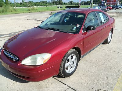 2003 ford taurus, red, very roomy, runs great, cold a/c, no reserve