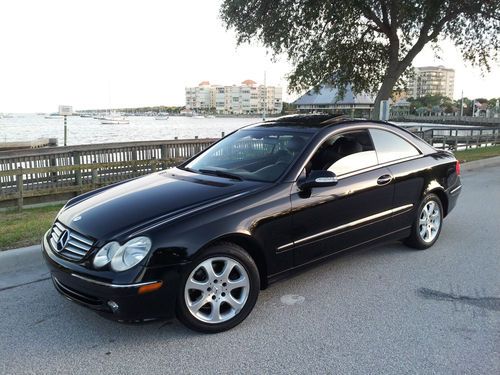 Black on black*sunroof*cd*leather*wheels*clean in and out must see