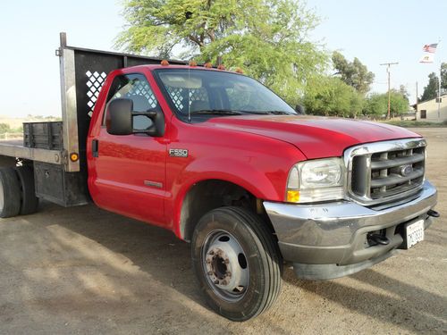 2004 ford f550  superduty w/12 ft flatbed in excellent condition
