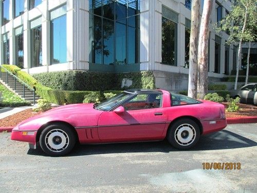 A red-on-red 1984 corvette w/ glass top, motor trend's car of the year !!!