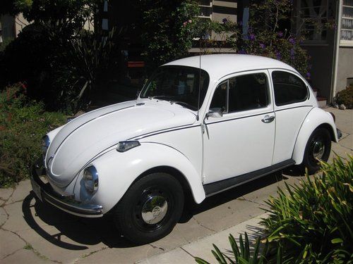 1972 volkswagen super beetle. white with black interior. 69k miles, extra parts!