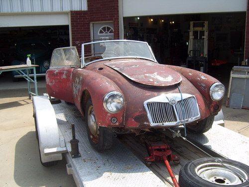 I found it. a 1961 mga roadster.   out of storage. not driven for many years