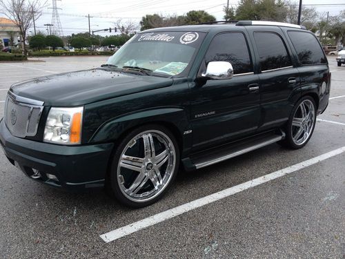 2002 escalade on dub 26"floaters,custom interior,4 tvs,low miles-must see!
