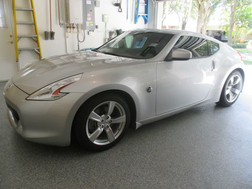 2011 nissan 370z with touring package and 6 speed manual; only 14,511 miles