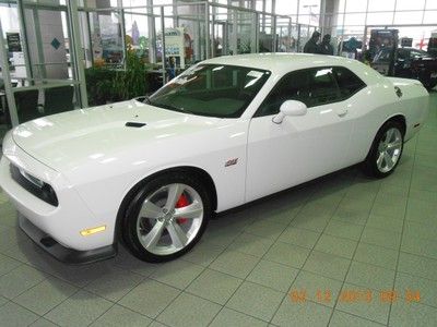 Introducing the 2012 dodge challenger. this coupe arrives in bright white and fe