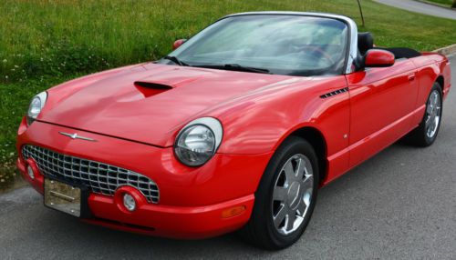 2002 torch red ford thunderbird w/hard top, leather w/red accent,