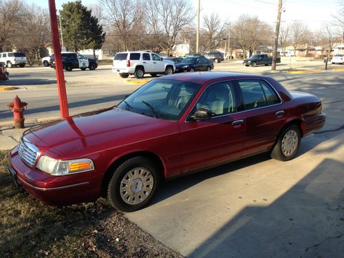 Red 2003 ford crown victoria