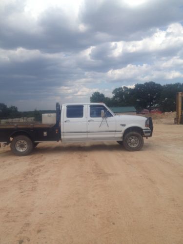 1997 f-350 xlt 4x4  7.3 powerstroke diesel crew cab. skirted cm flatbed. airbags