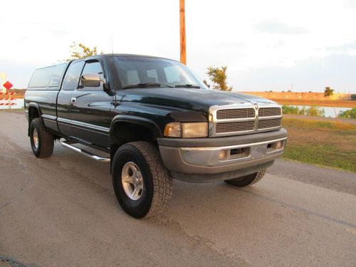 1997 dodge ram 1500, ext. cab 4x4, bed camber, low miles.