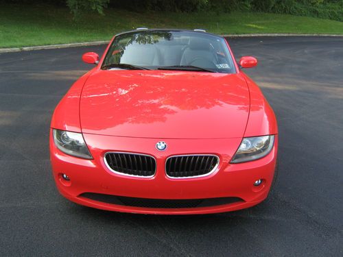 2005 red bmw z4 2.5i convertible two door with approx. 20,000 miles