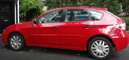Lightening red 4wd subaru impreza 2.5i  wagon 2008 36,200 4cyl ivory interior