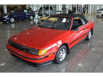 Showroom condition red convertible low miles soft top