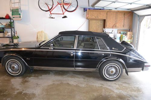 1985 cadillac seville elegante sedan 4-door 4.1l with pesidential trim package