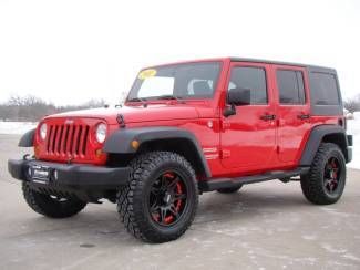 Jeep wrangler unlimited four door sport aftermarket rims match the jeep perfect!