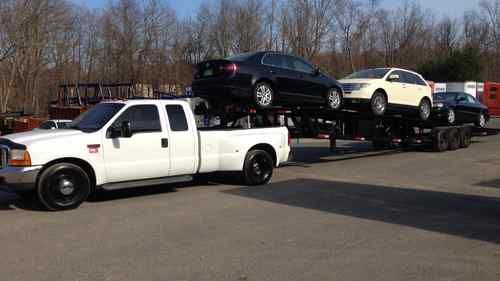 2000 ford f350 7.3l  dually with 3 car trailer