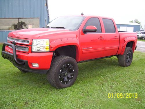 Beautiful red loaded chevy crewcab 1500 4x4 lots of extras