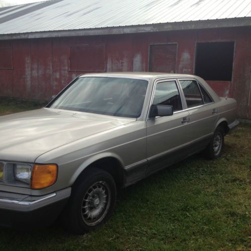 1985  mercedes-benz 300 sd light gray with red interior.