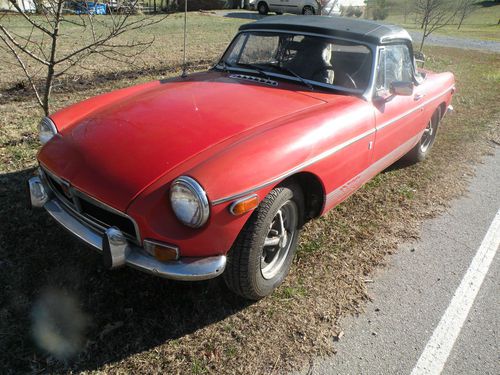 Classic mgb roadster with factory overdrive and chrome bumpers.