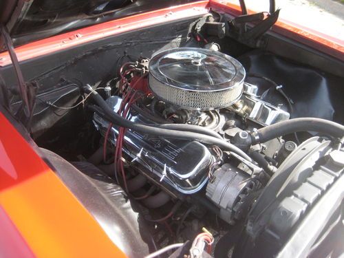 1966 chevelle. big block chevy 454, slap shifter, red with black interior.