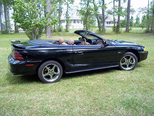 5 liter/5 speed, convertible, black, tan top, tan leather int, 17' cobra wheels