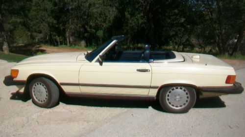 1987 mercedes benz 560sl coupe with hard and soft top, ivory with blue interior