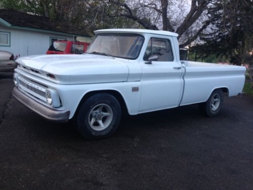Chevy c10 - white, long bed, with original 327 4 speed manual, runs very good.