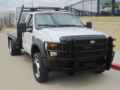 Look this texas own 2009 f-550 flate bed low miles 90k with warranty