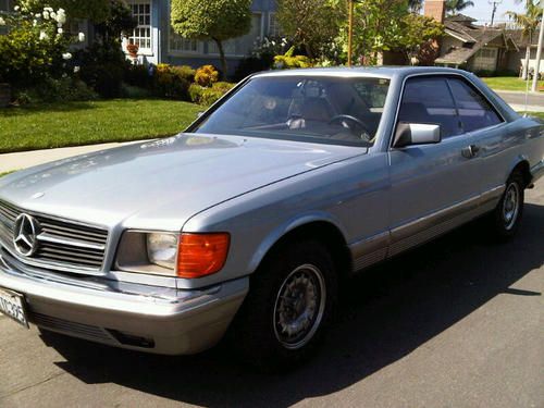 1982 380 sec, 2nd owner, salvage title due to door accident. silver blue/tan