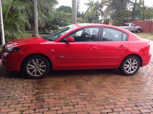 2007 red mazda 3 in very good condition, runs well, low mileage