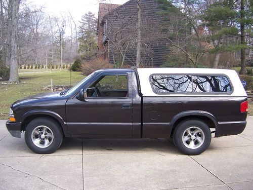 1998 chevy s-10 with truck cap.  4 cylinder, ac. runs good, good tires, brakes.