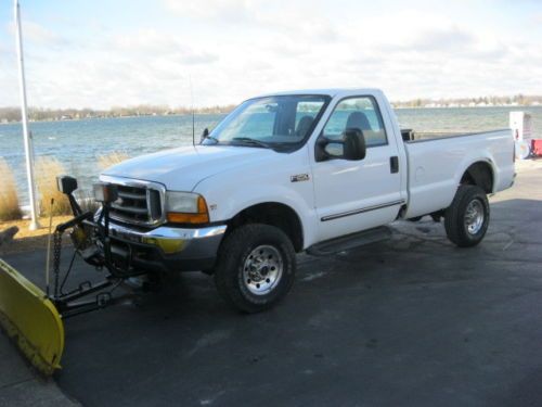 **no reserve** 1999 ford f250 4 x 4 with plow.  good running truck