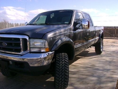 2004 lifted f350 4x4 crew cab lariat long bed diesel "no reserve"