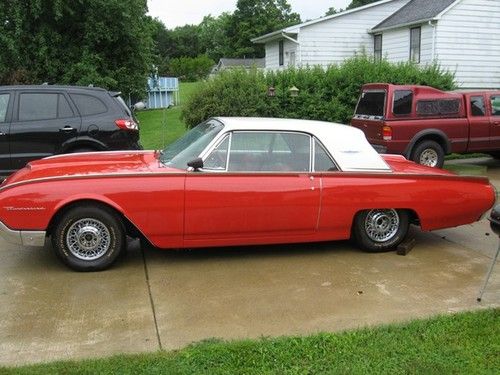 Red and white two-door hardtop