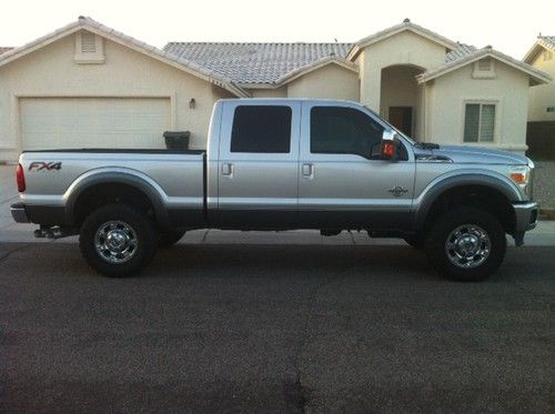2012 ford f350 4x4 lariat fx 4 crew cab, silver/charcoal ext., black leather int