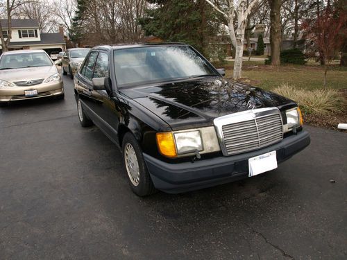1986 black mercedes-benz 300 e sedan,  good condition.