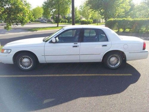 White, leather , no rust, four door,
