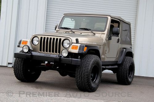 Rubicon,6 spd manual,lifted,brand new 33x12.50 a/t tires,tow package
