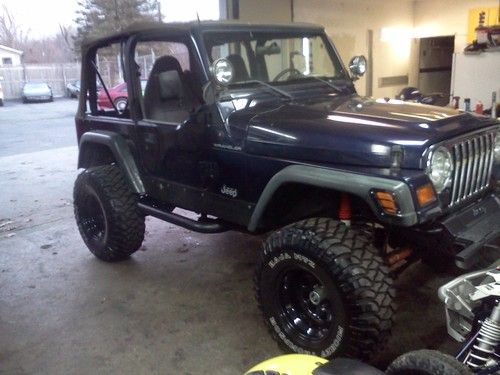 1998 jeep wrangler tj , lifted loaded w/ good stuff , no rust &amp; low miles, ready