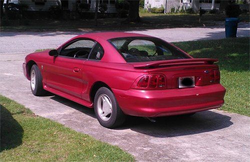 1998 ford mustang.  red, 5 speed