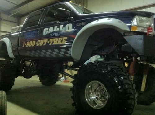 2002 blue f350 lariate crew cab lifted truck