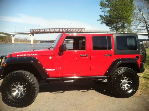 2011 red jeep wrangler unlimited rubicon - impressively outfitted w/ 37" toyos!